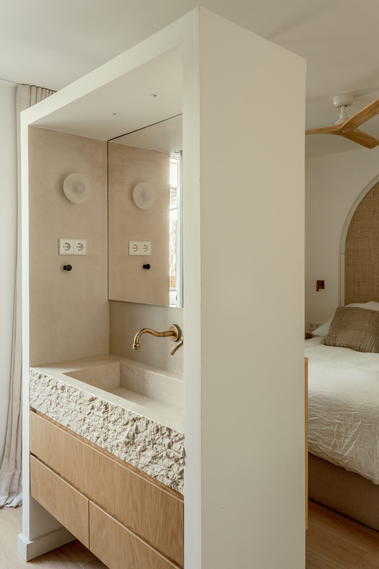 Carved stone washbasin with brass tap, Apartamento Perla, Barcelona